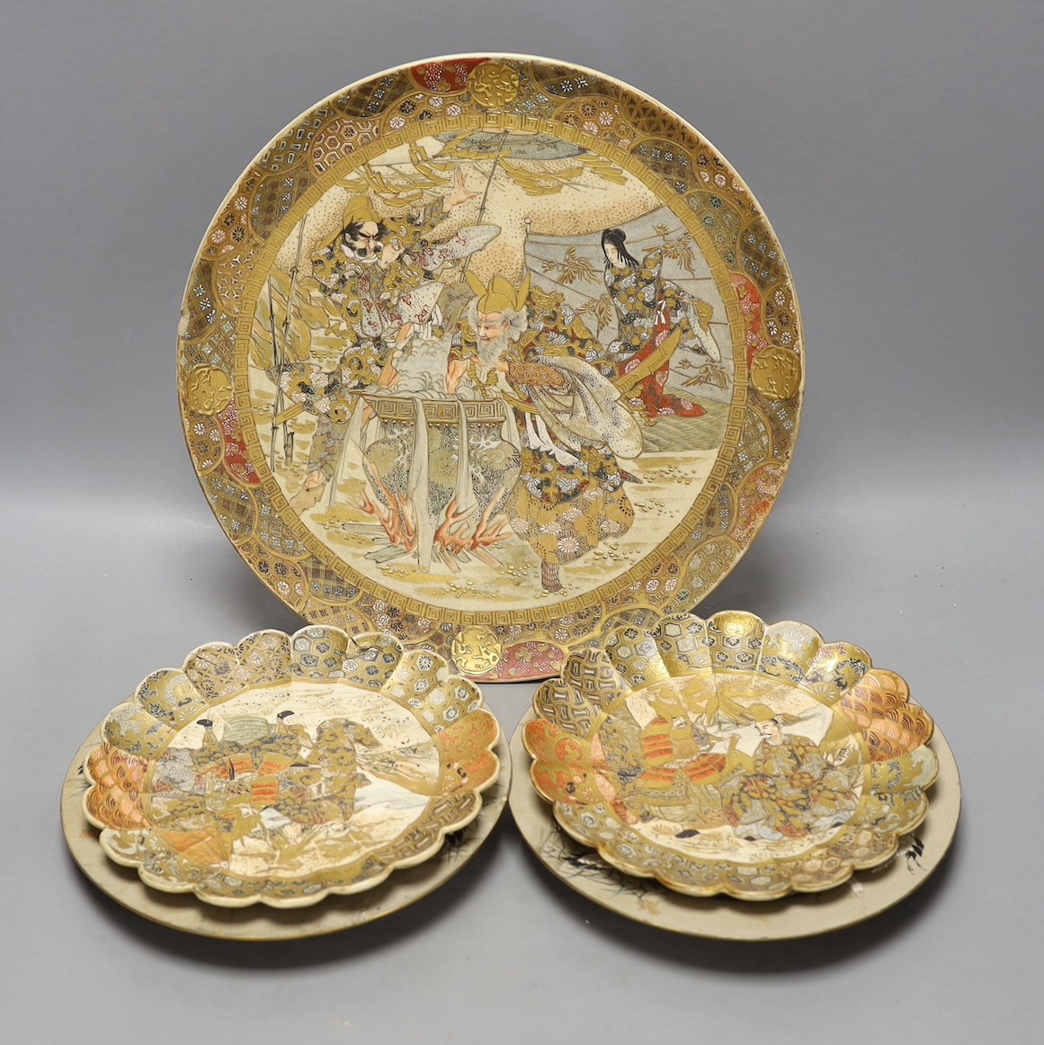 Three Japanese Satsuma dishes and a pair of plates - largest 31cm diameter